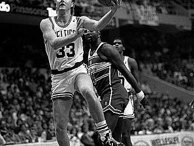 Larry Bird going up for a layup in a Boston uniform